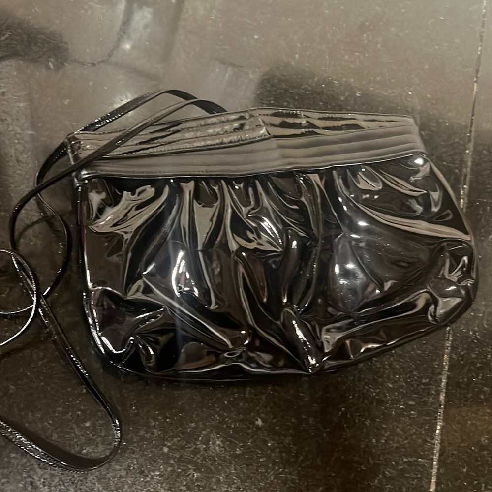 Black shiny leather clutch with long handle option